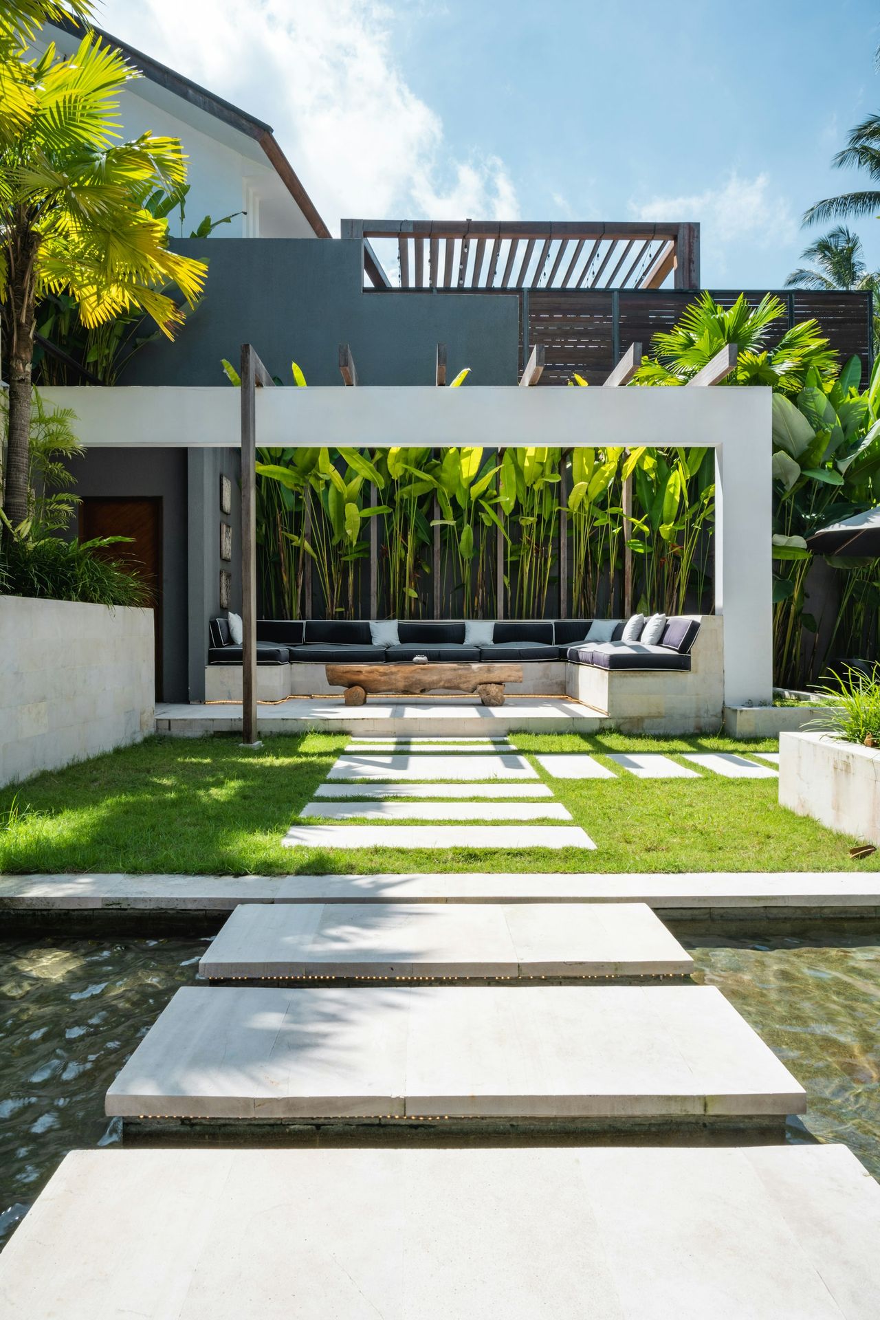 A modern house with a pool in front of it